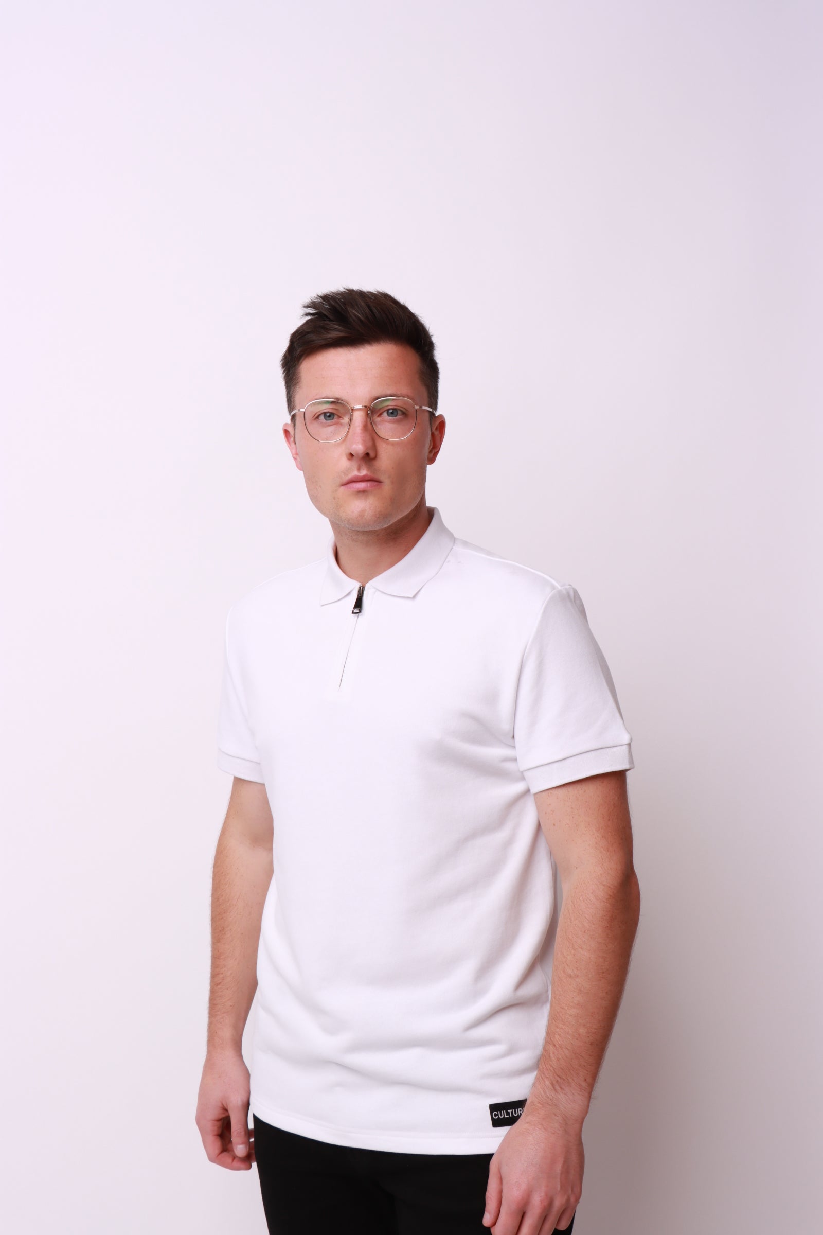 This is a white polo shirt with CULTURE logo, perfectly crafted by cultureclothing using the best brushed cotton