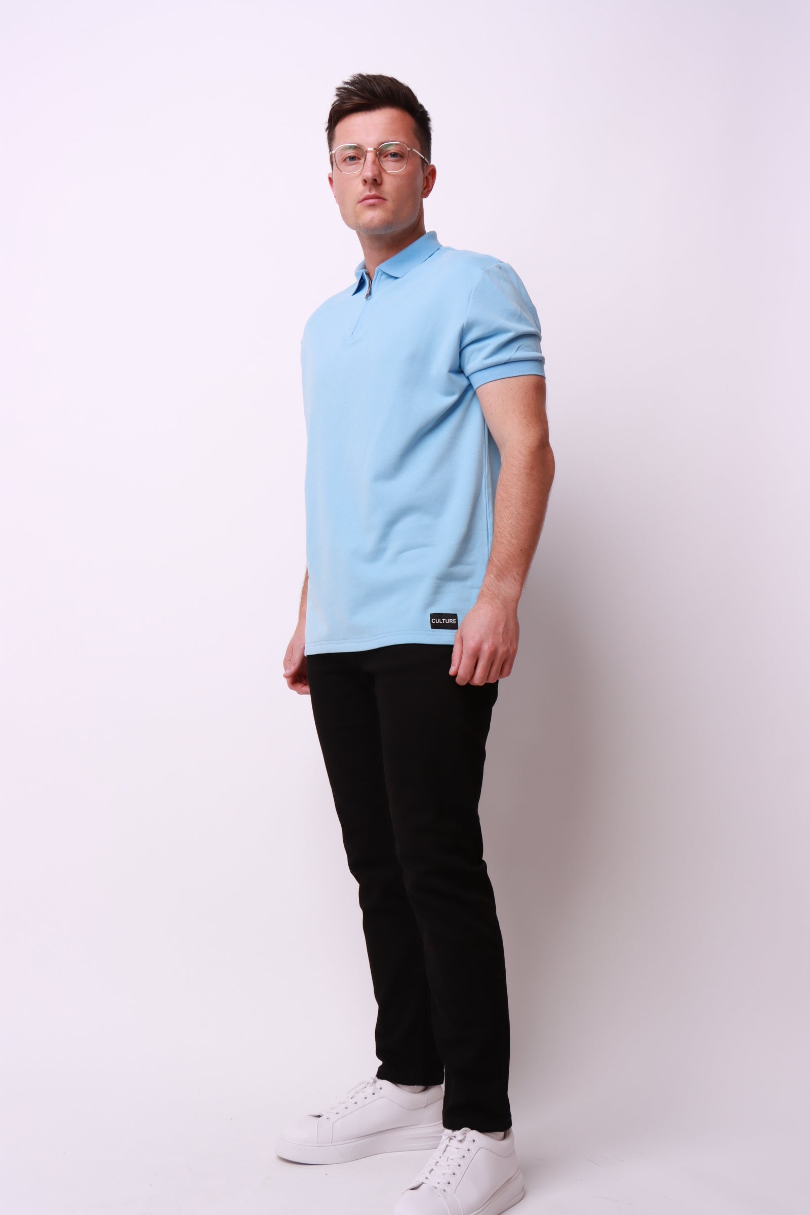 This luxury brand zip polo shirt, made using brushed cotton with culture logo